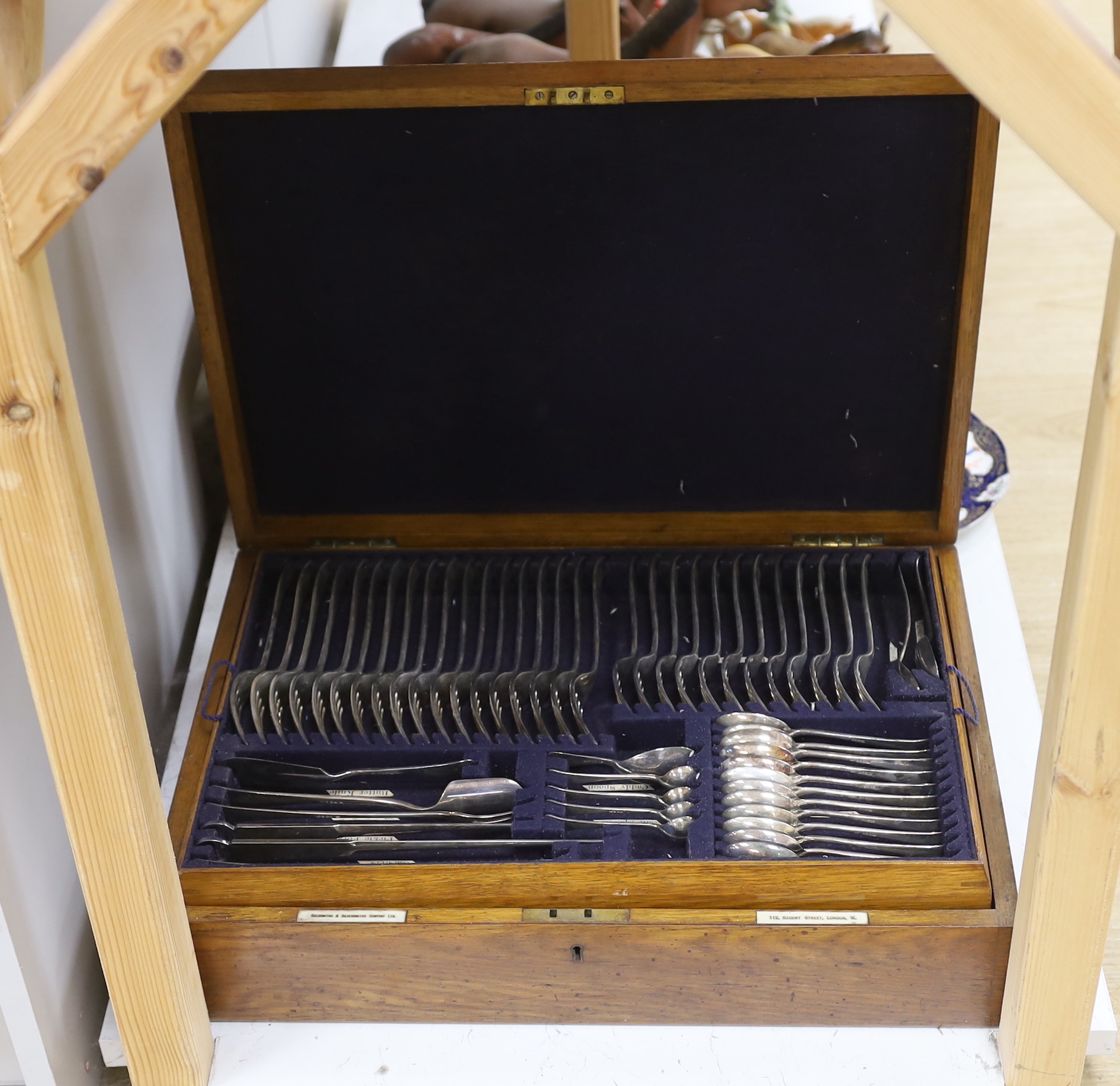 An oak canteen of plated suite of cutlery